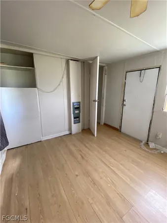 a view of an empty room with a fireplace