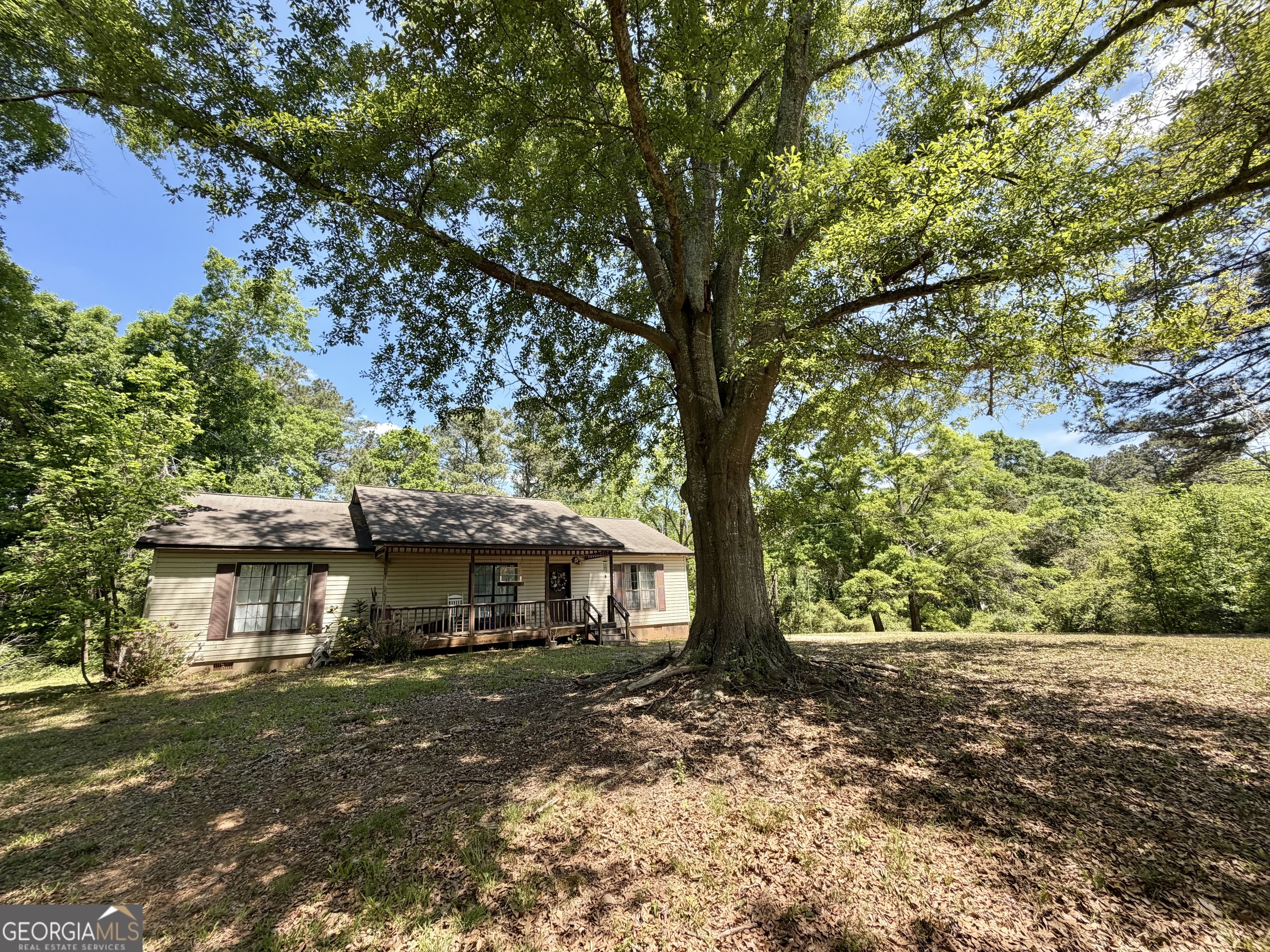276 Oglesby Bridge Road Southeast Conyers, GA 30094 - Photo 1 of 49 a front view of a house with a yard