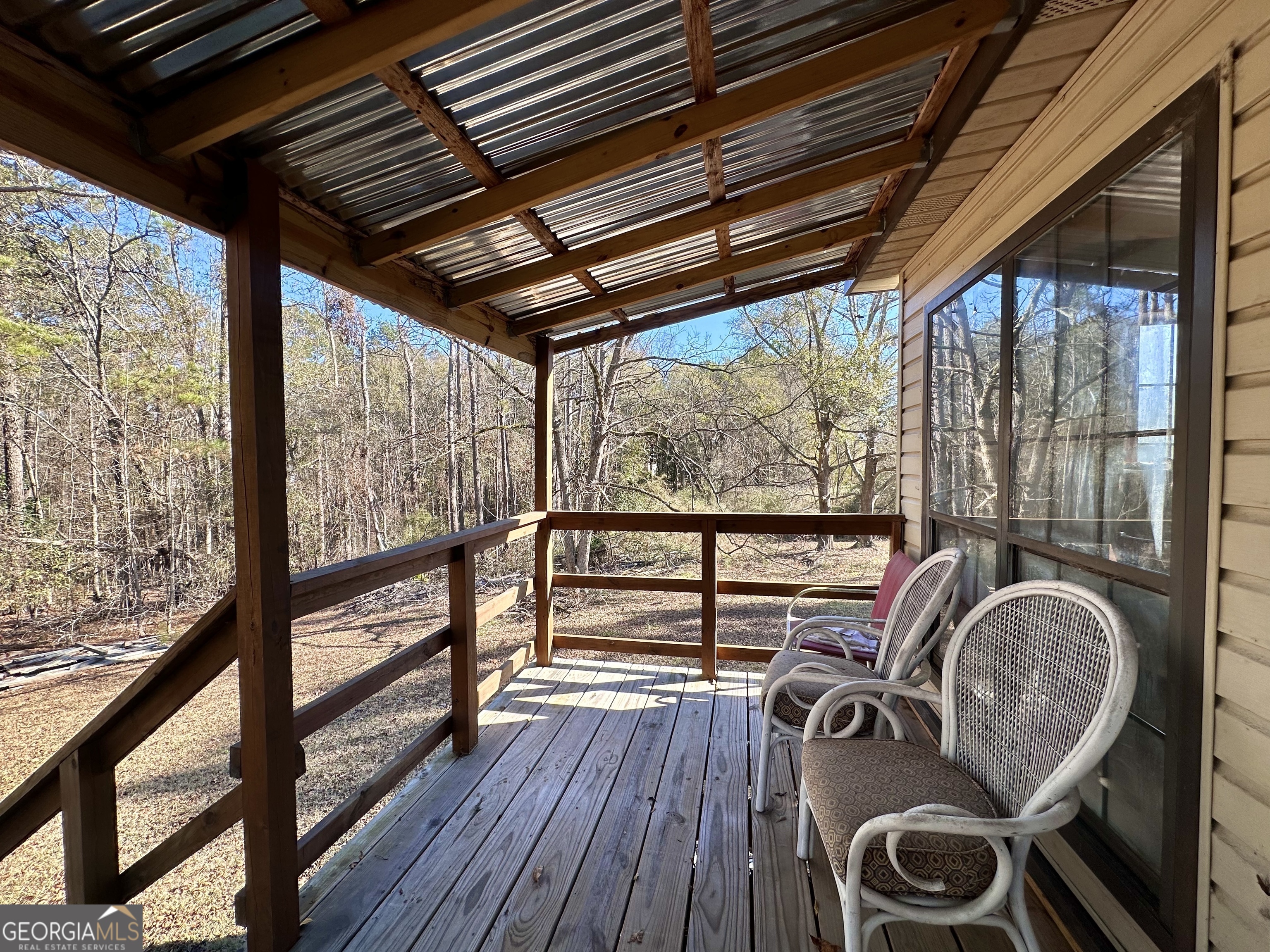 276 Oglesby Bridge Road Southeast Conyers, GA 30094 - Photo 17 of 49 a view of room with wooden floor and furniture