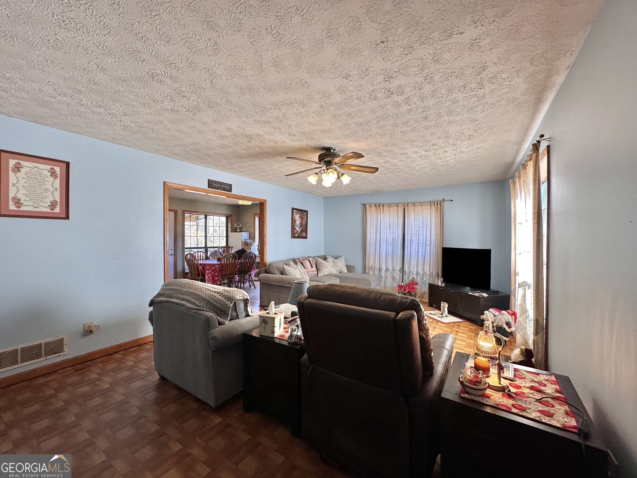 276 Oglesby Bridge Road Southeast Conyers, GA 30094 - Photo 23 of 49 a living room with furniture and a flat screen tv