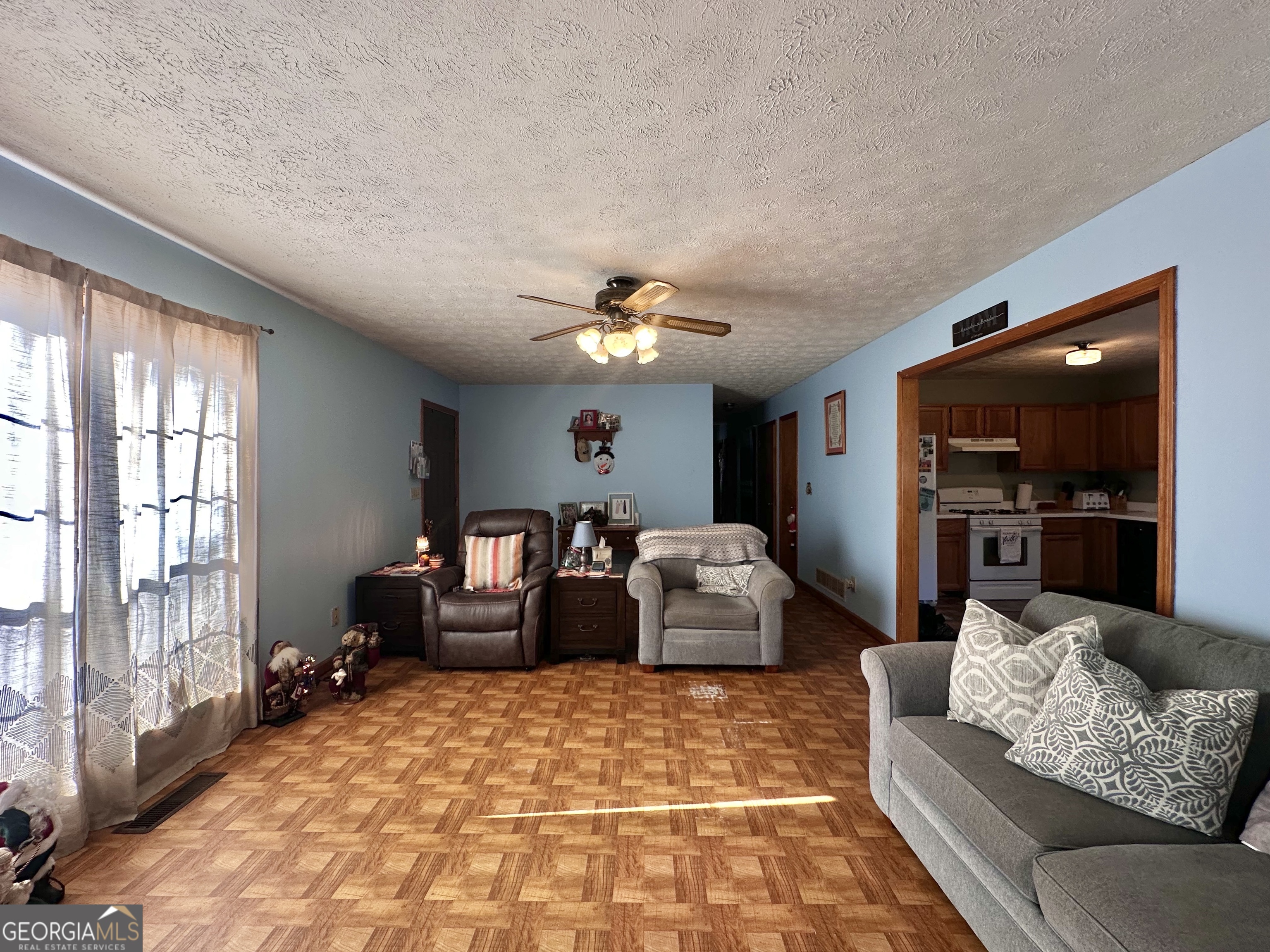 276 Oglesby Bridge Road Southeast Conyers, GA 30094 - Photo 26 of 49 a living room with furniture and a flat screen tv
