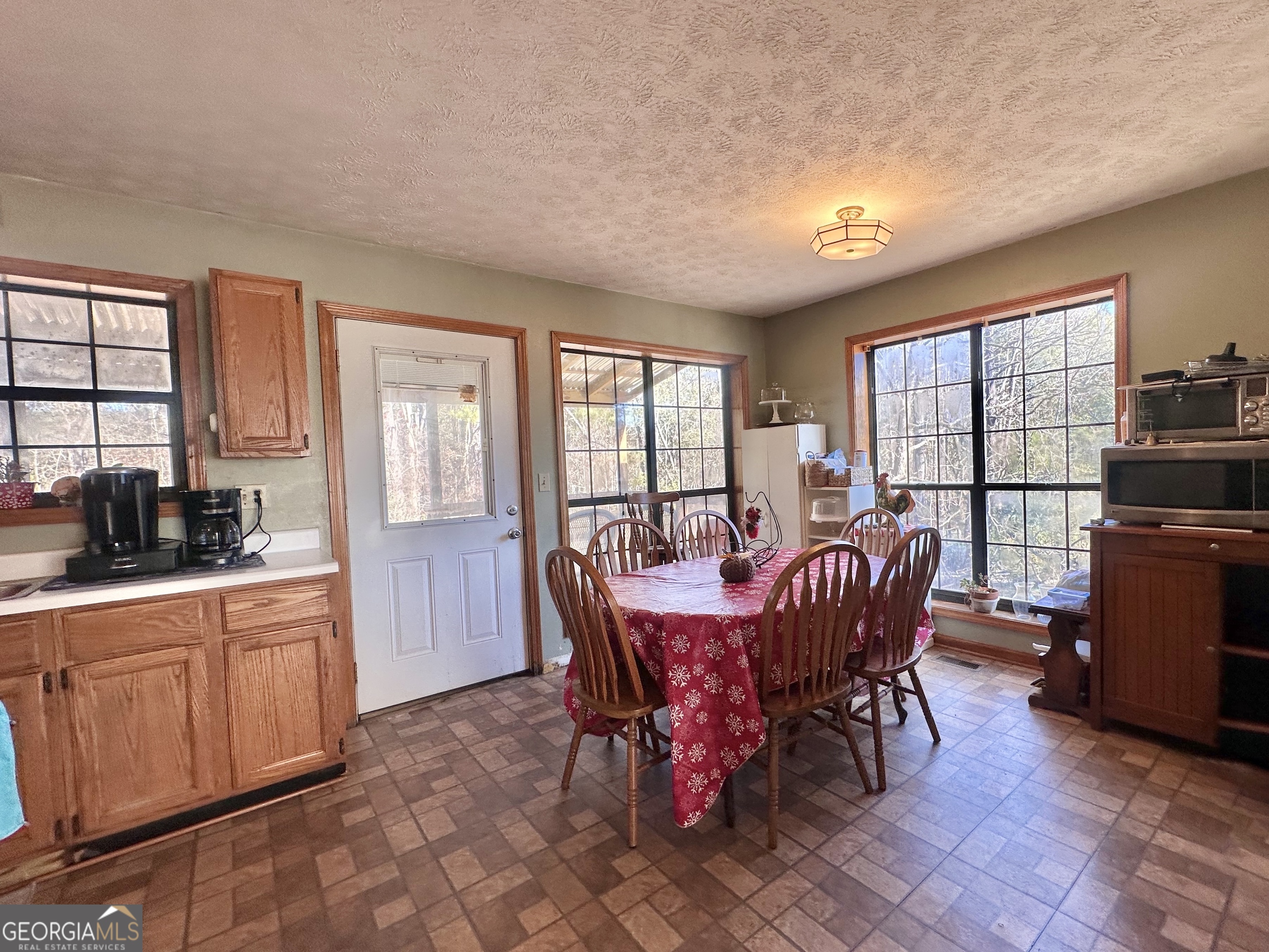 276 Oglesby Bridge Road Southeast Conyers, GA 30094 - Photo 35 of 49 a view of a dining room with furniture window and outside view
