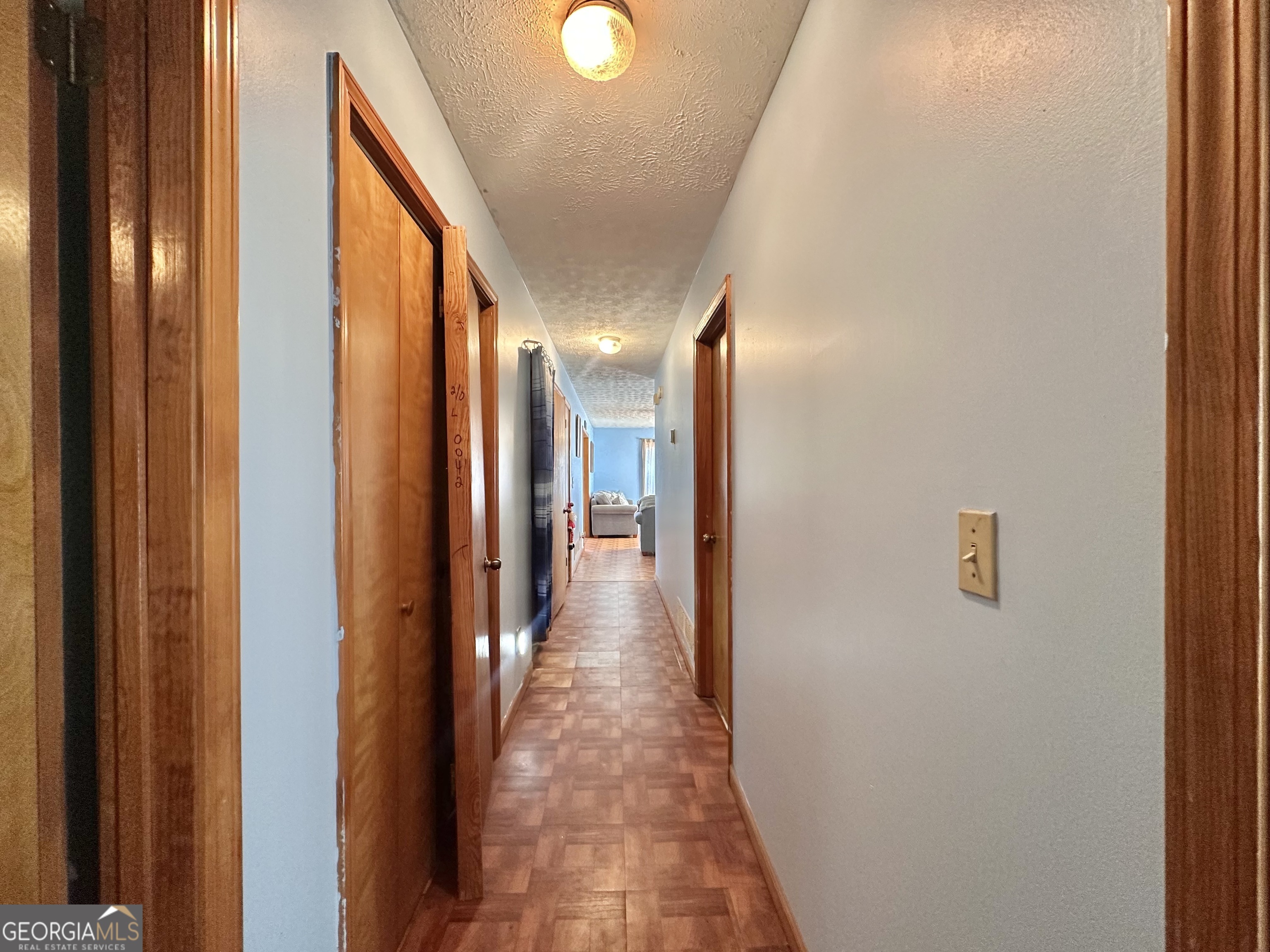 276 Oglesby Bridge Road Southeast Conyers, GA 30094 - Photo 37 of 49 a view of a hallway with wooden floor