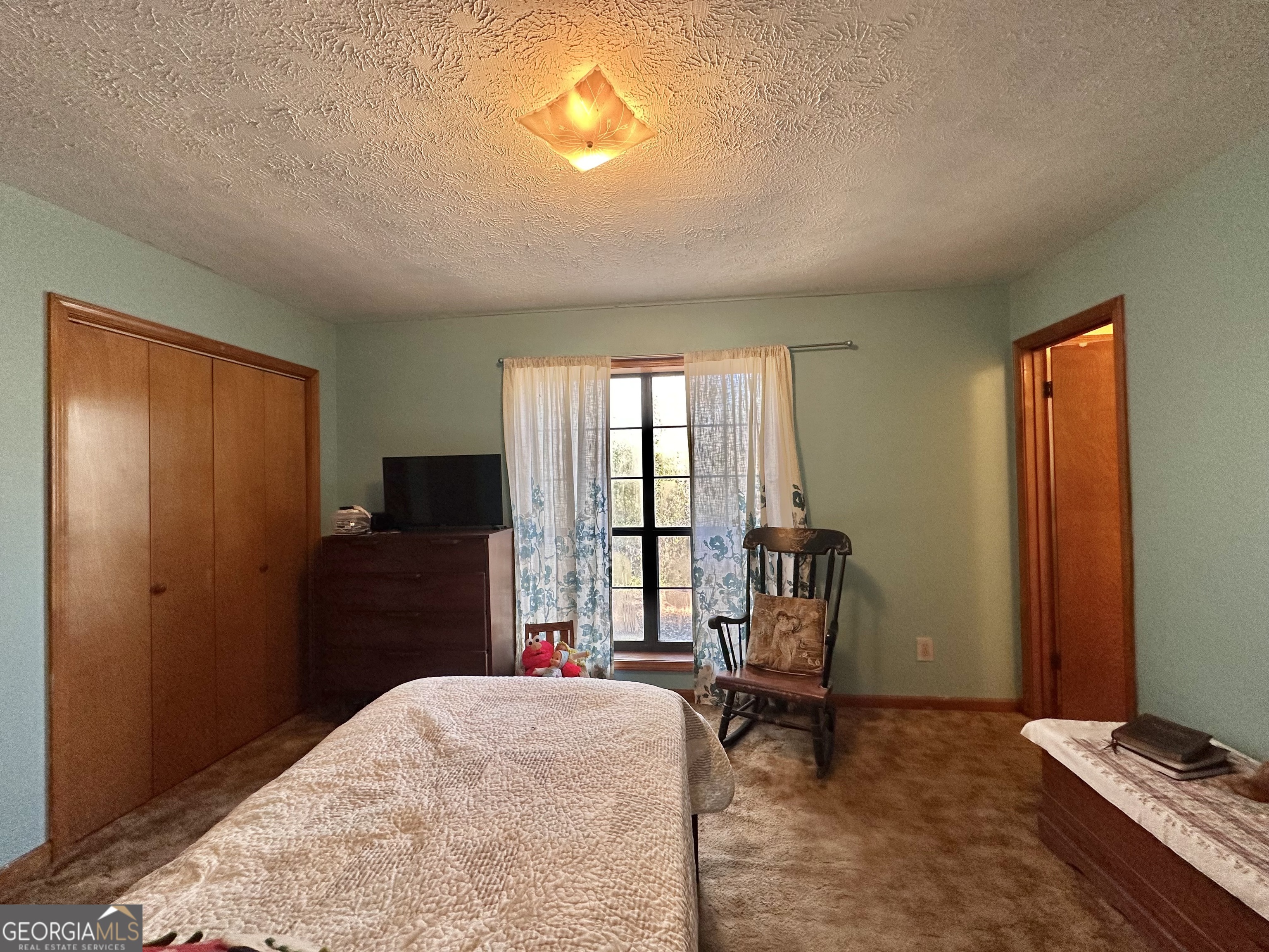 276 Oglesby Bridge Road Southeast Conyers, GA 30094 - Photo 43 of 49 a bedroom with a bed and a window