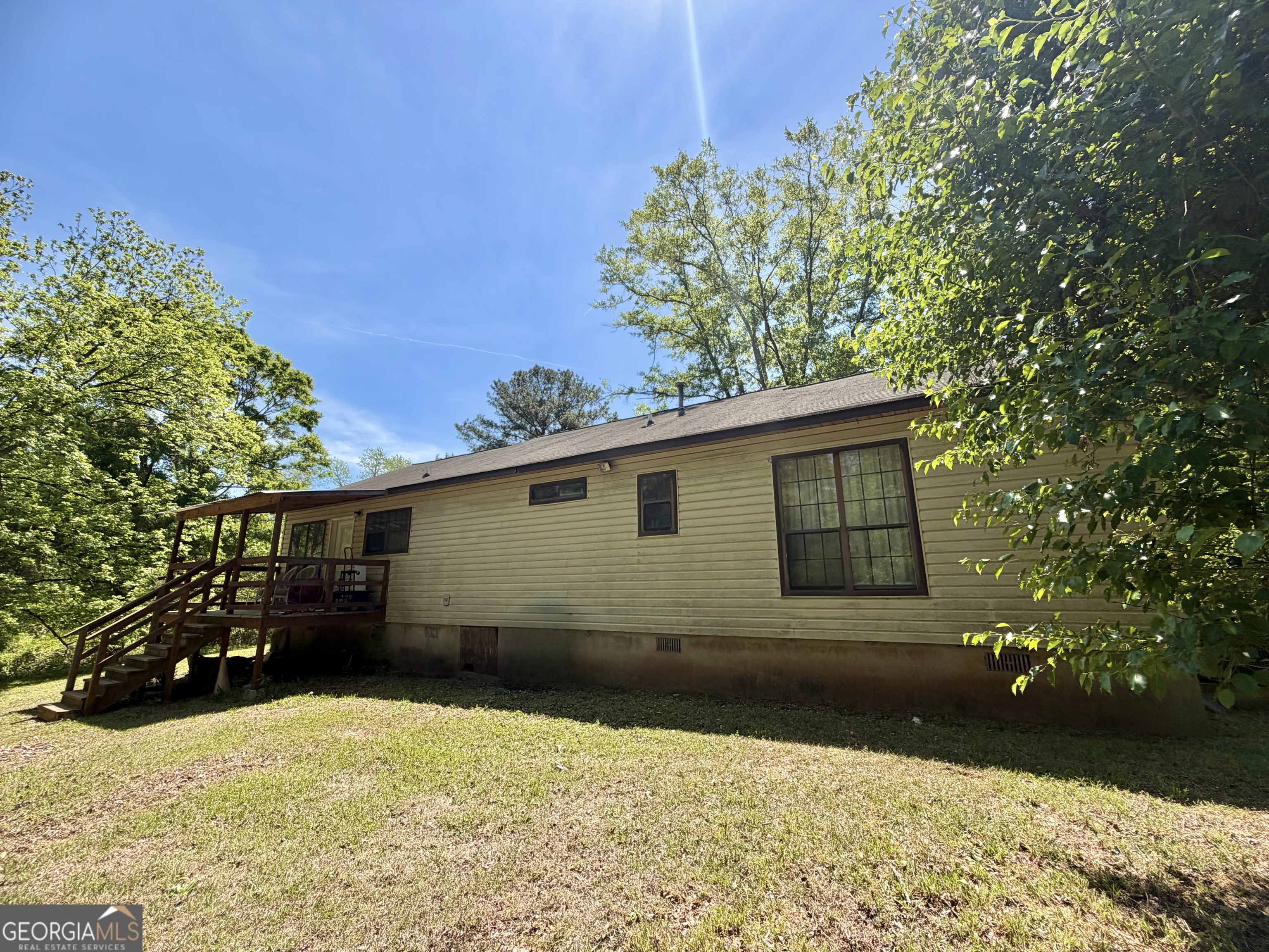276 Oglesby Bridge Road Southeast Conyers, GA 30094 - Photo 8 of 49 a backyard of a house with lots of green space