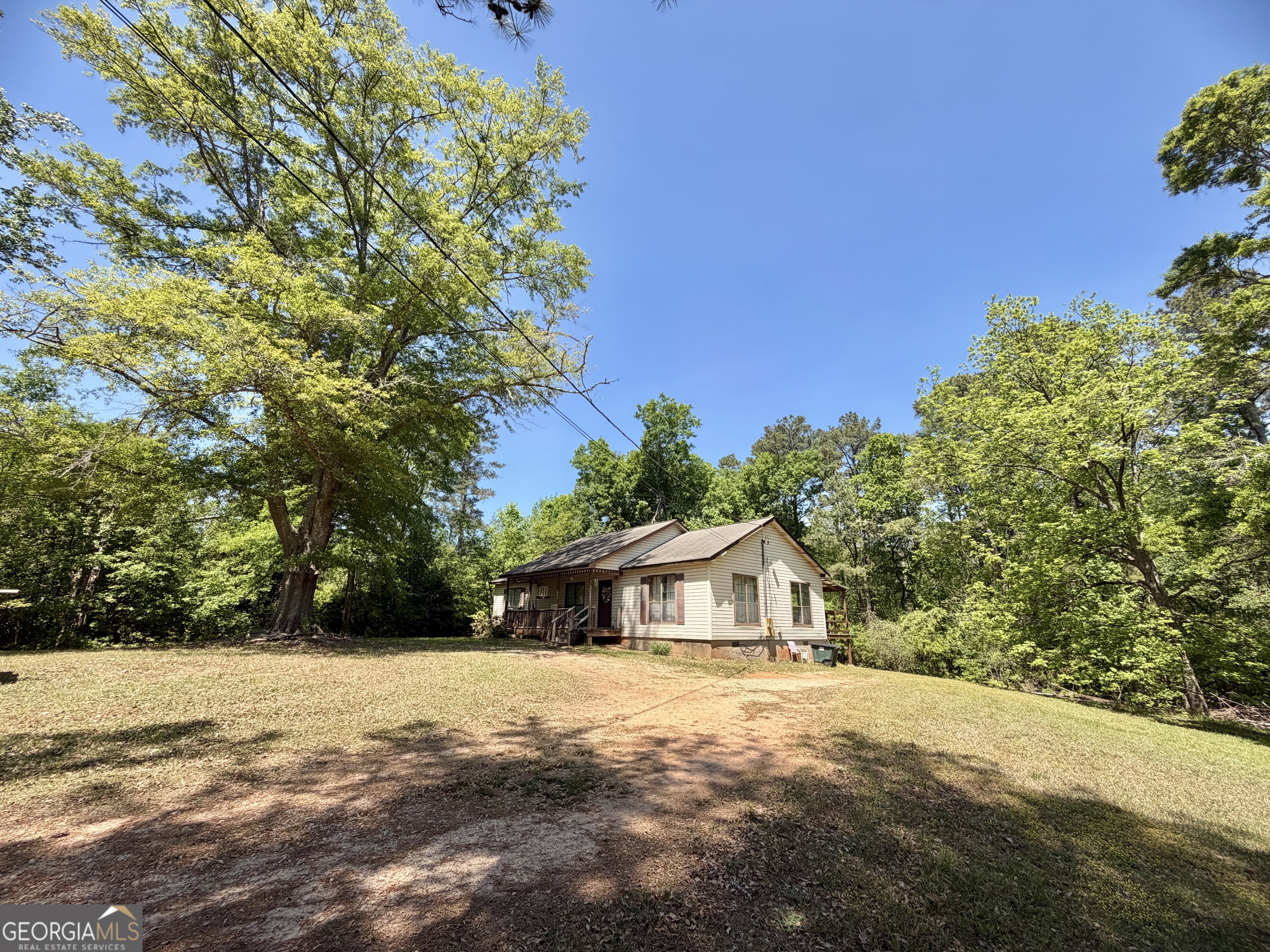 276 Oglesby Bridge Road Southeast Conyers, GA 30094 - Photo 10 of 49 a front view of a house with a yard