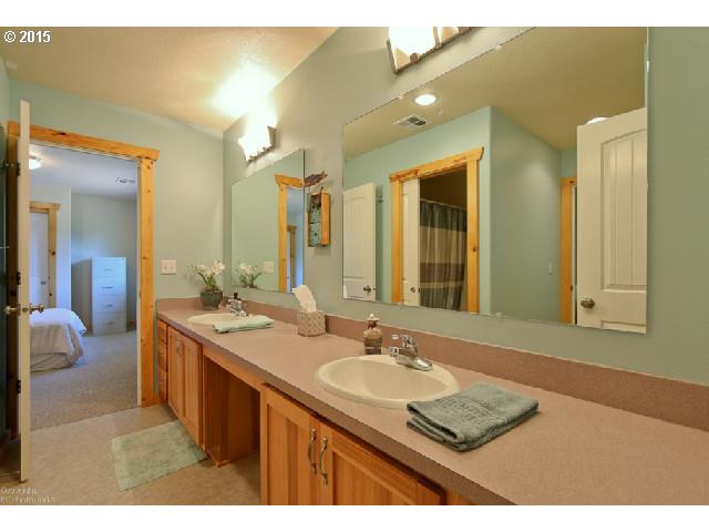62 Rancho Del Oro Road Stevenson, WA 98648 - Photo 13 of 15 a bathroom with a sink double vanity granite and a mirror