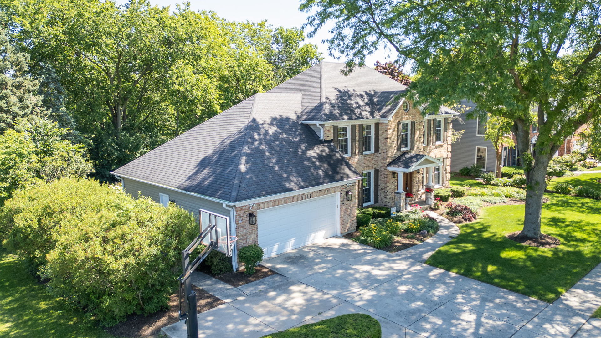 453 Brighton Drive Wheaton, IL 60189 - Photo 2 of 40 a view of a house with a yard and potted plants