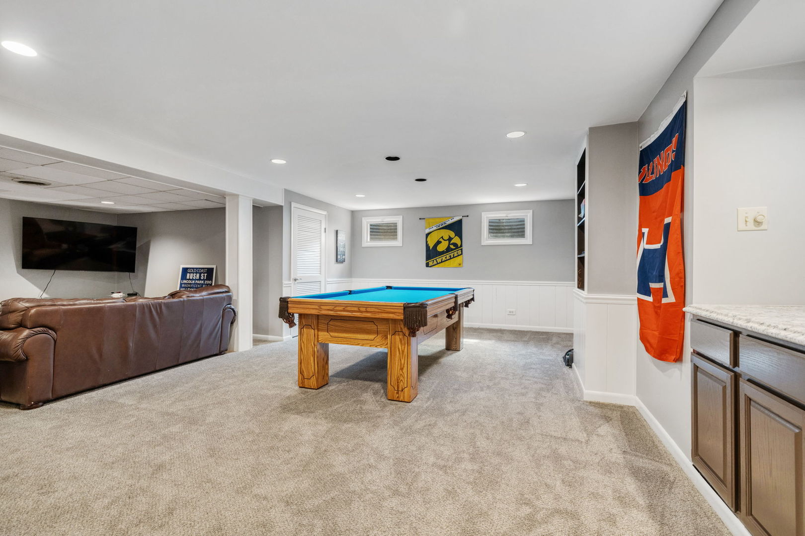 453 Brighton Drive Wheaton, IL 60189 - Photo 25 of 40 a living room with furniture and a flat screen tv