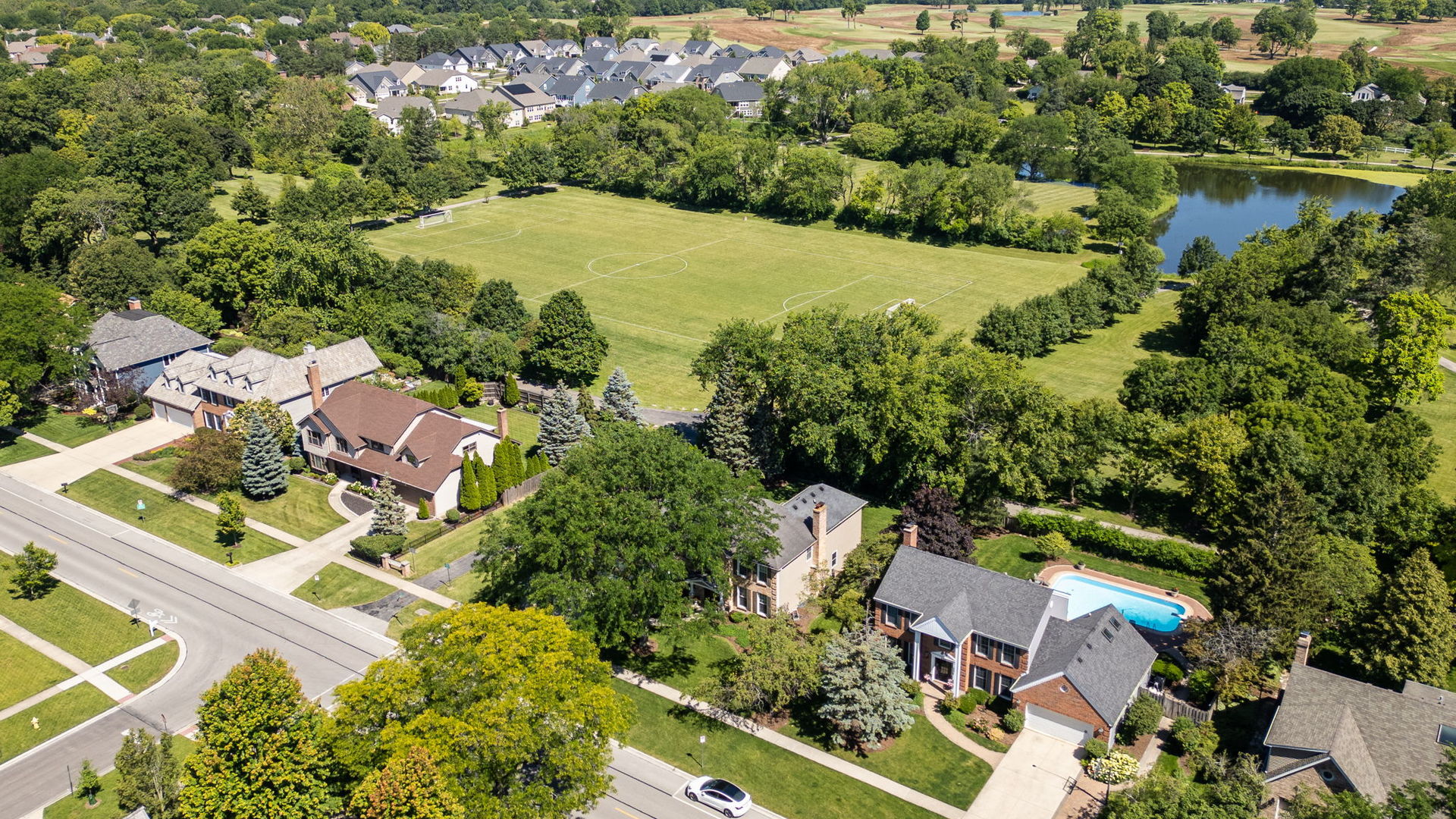 453 Brighton Drive Wheaton, IL 60189 - Photo 3 of 40 an aerial view of residential house with outdoor space and lake view