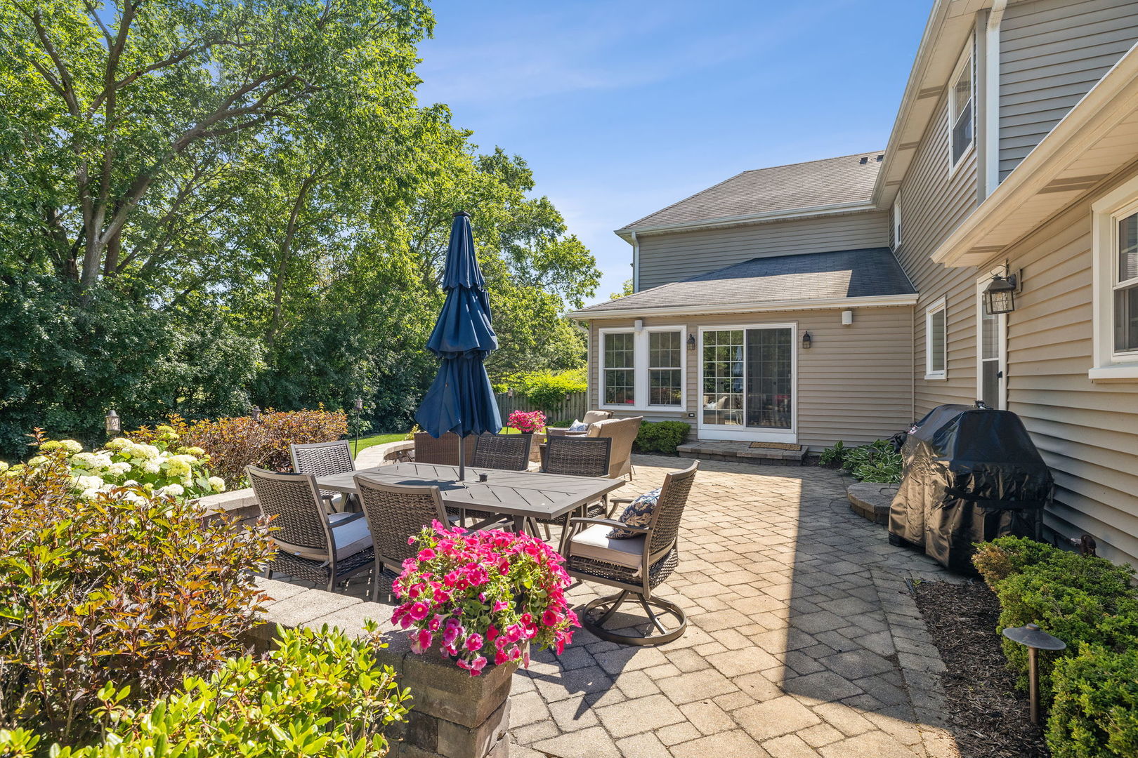 453 Brighton Drive Wheaton, IL 60189 - Photo 36 of 40 a view of a house with backyard sitting area and garden