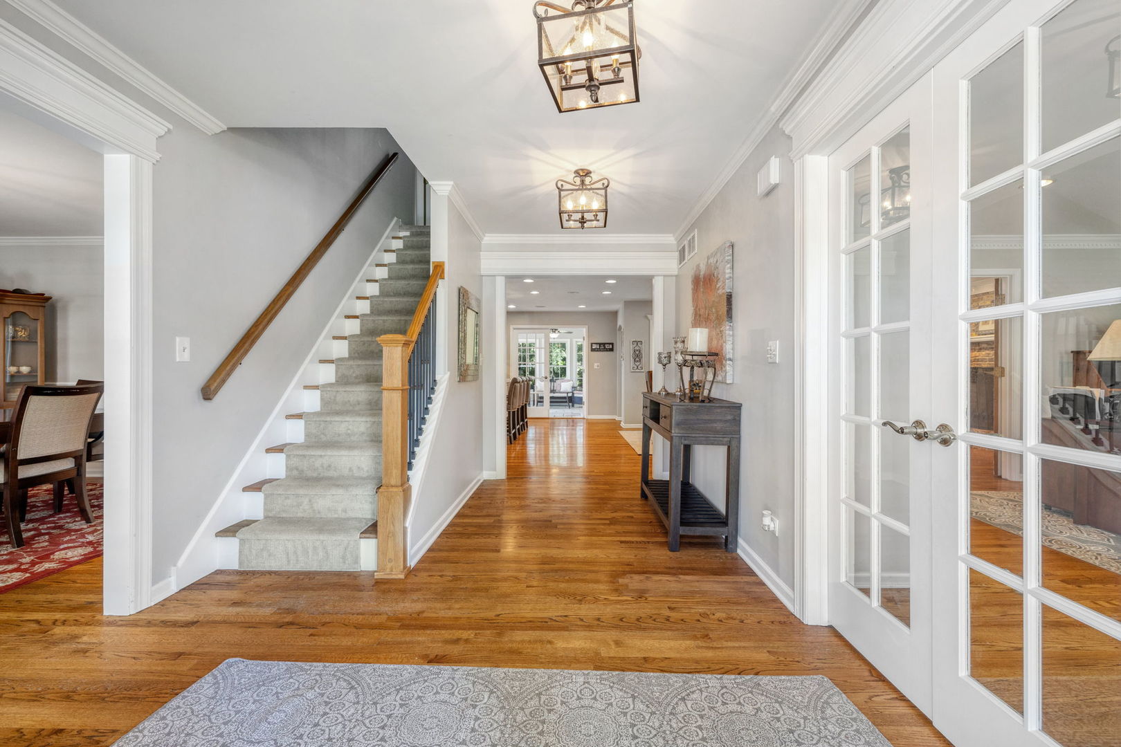 453 Brighton Drive Wheaton, IL 60189 - Photo 6 of 40 a view of a hallway view with wooden floor and staircase