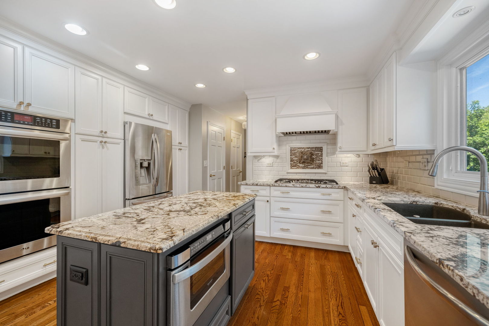 453 Brighton Drive Wheaton, IL 60189 - Photo 10 of 40 a kitchen with a sink stove and refrigerator