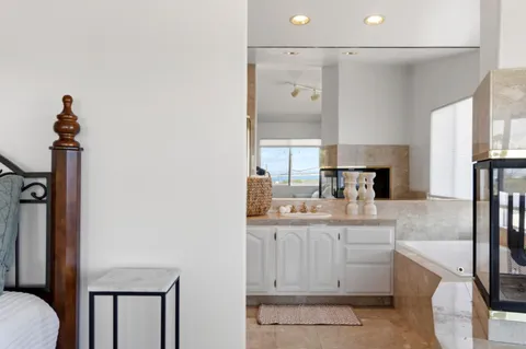 a kitchen with a sink appliances and cabinets
