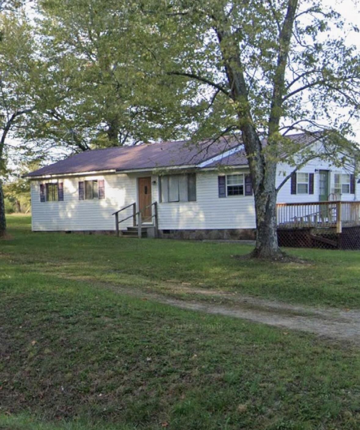 2485 Ladd Springs Road Southeast Old Fort, TN 37362 - Photo 1 of 5 a front view of house with yard and green space