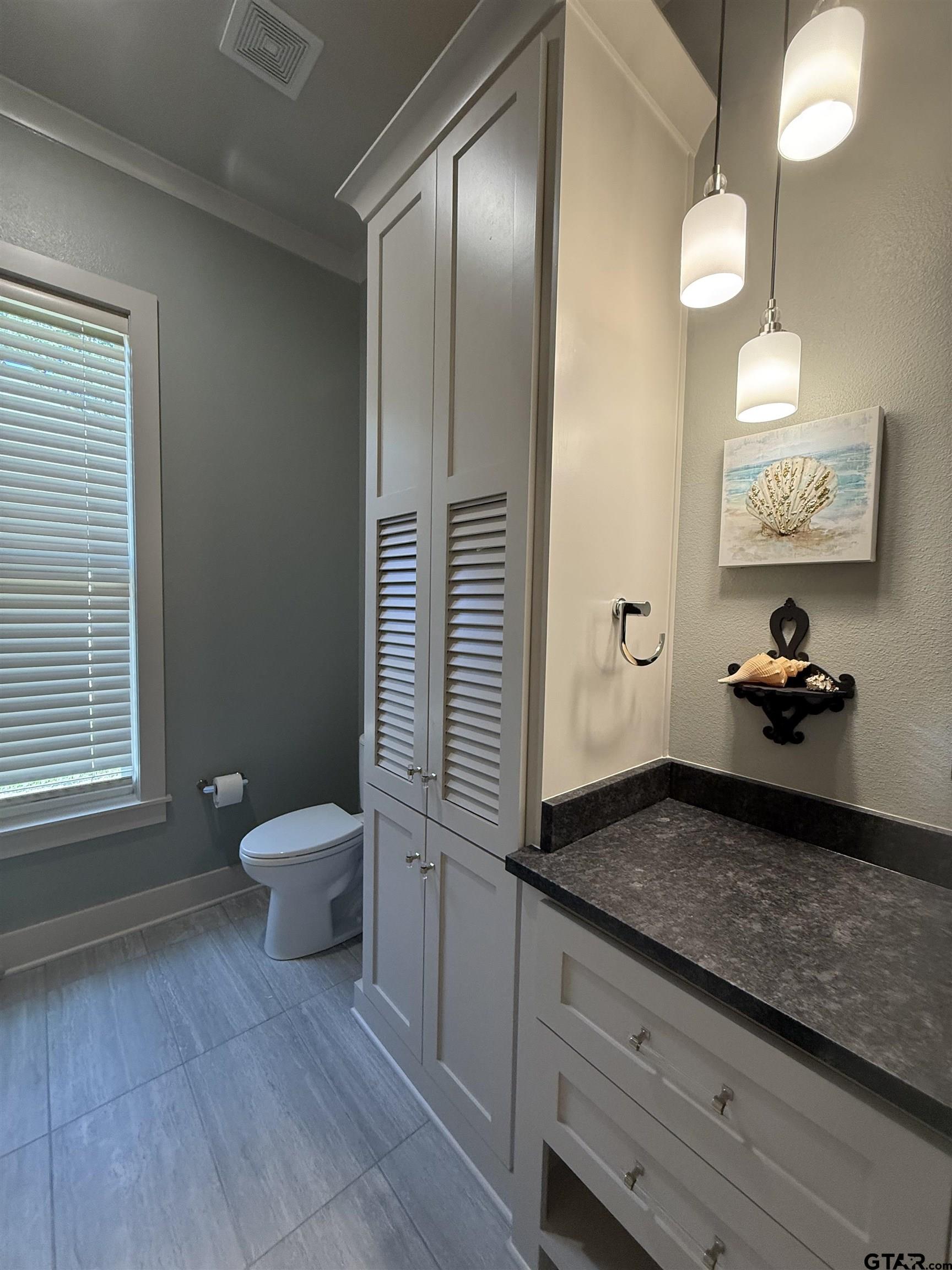 313 Sunset Circle Bullard, TX 75757 - Photo 16 of 48 a bathroom with a granite countertop sink and a mirror