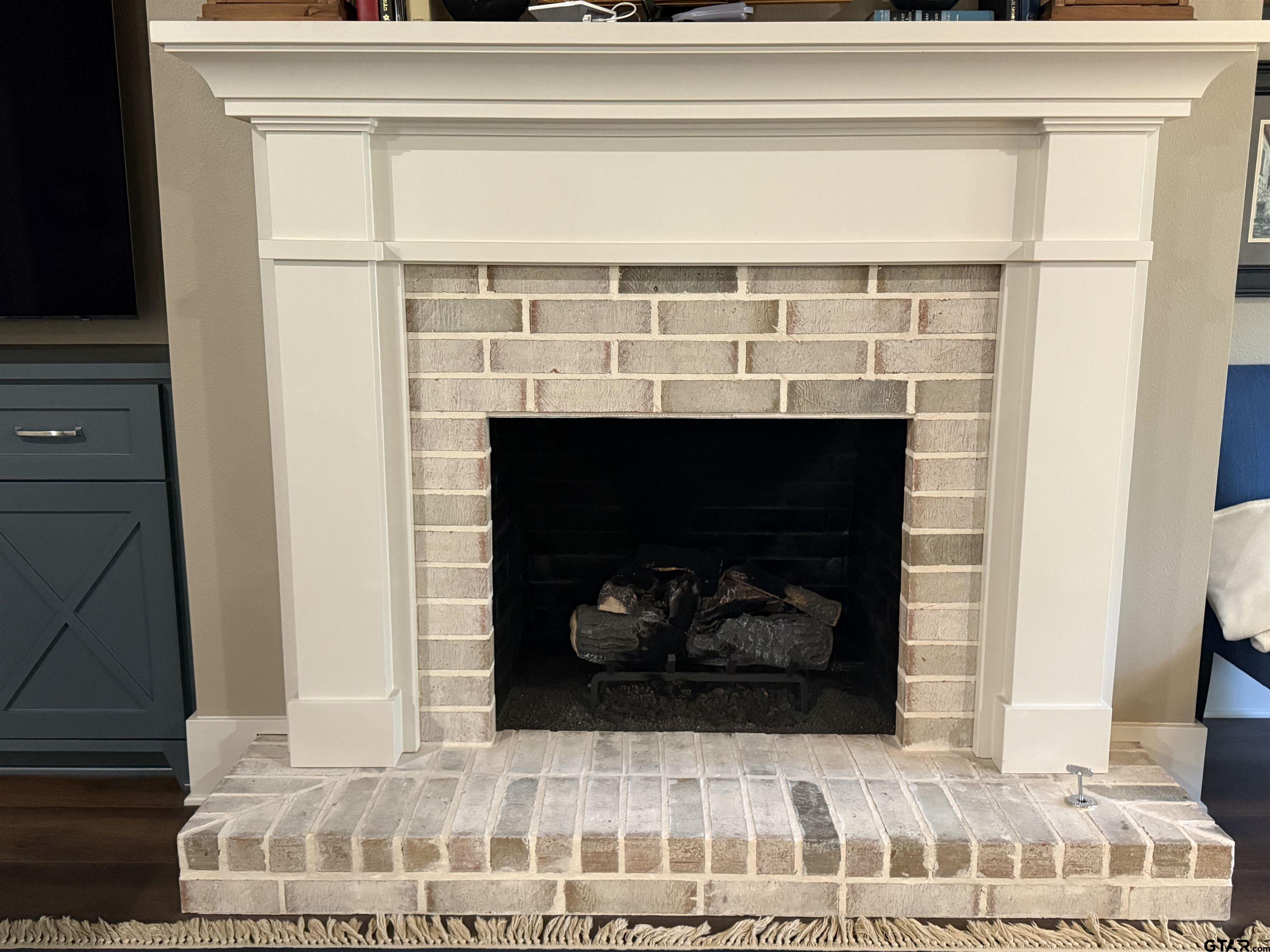 313 Sunset Circle Bullard, TX 75757 - Photo 34 of 48 a living room with a fireplace and a table