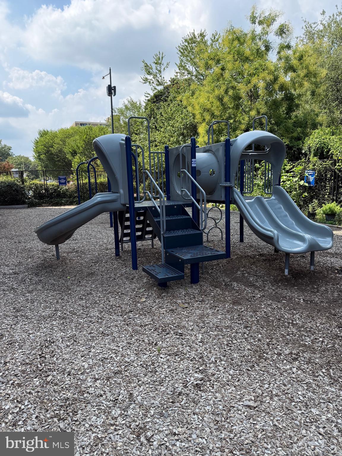 1311 Delaware Avenue Southwest, Unit S540 Washington, DC 20024 - Photo 12 of 17 a view of a bench in the backyard