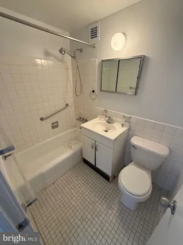 a white stove top oven sitting inside of a kitchen