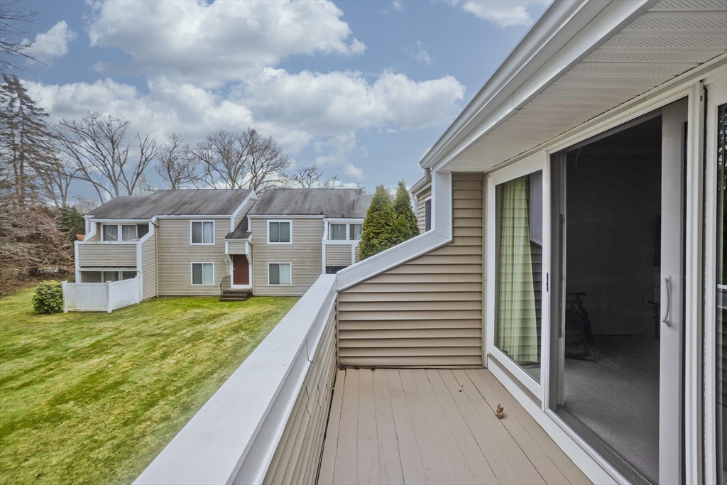 286 Nassau Drive, Unit 286 Springfield, MA 01129 - Photo 17 of 19 a view of a house with backyard and porch