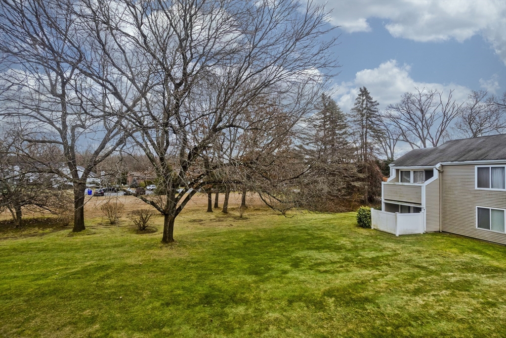 286 Nassau Drive, Unit 286 Springfield, MA 01129 - Photo 18 of 19 a view of a house with a yard