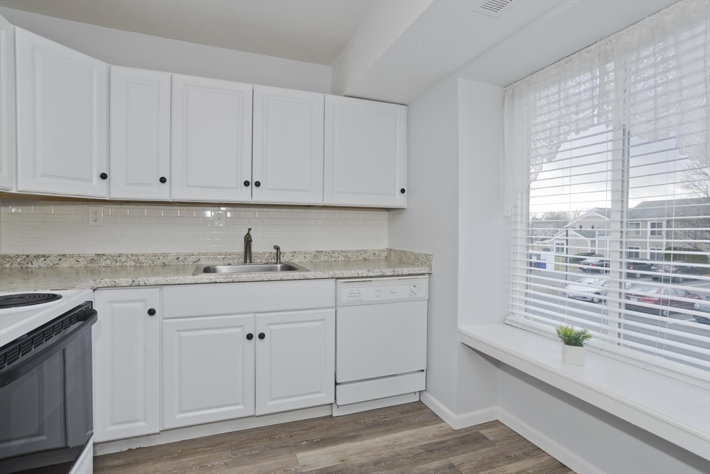 286 Nassau Drive, Unit 286 Springfield, MA 01129 - Photo 2 of 19 a room view with granite countertop a sink and a window