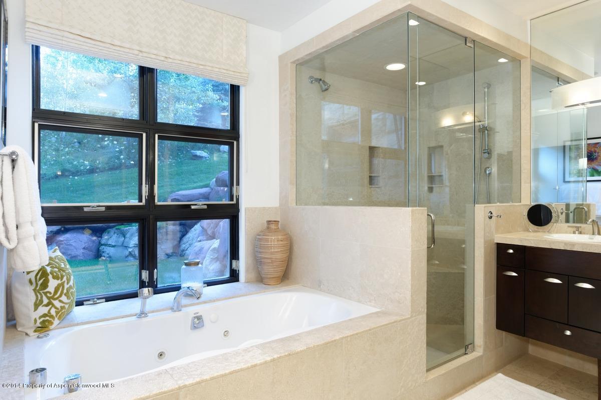 416 Moore Drive Aspen, CO 81611 - Photo 19 of 28 a bathroom with a bathtub and a sink