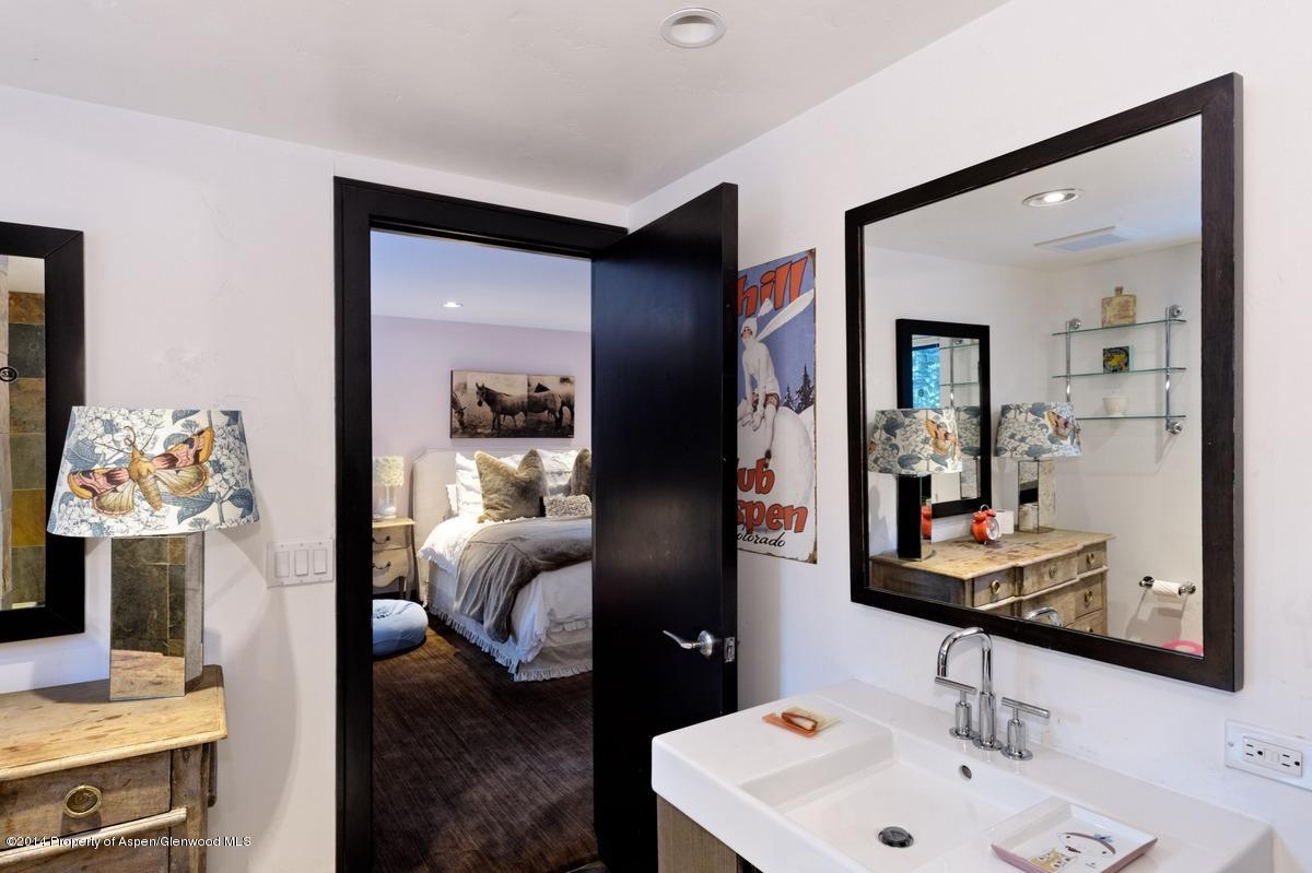 416 Moore Drive Aspen, CO 81611 - Photo 22 of 28 a en suite bathroom with a sink and a mirror