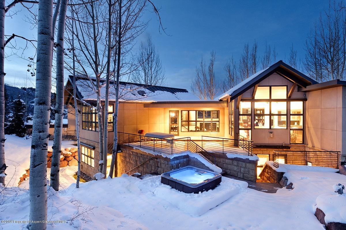 416 Moore Drive Aspen, CO 81611 - Photo 3 of 28 a living room with furniture a rug and a flat screen tv