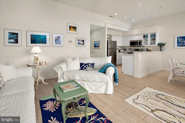 a kitchen with stainless steel appliances a refrigerator stove and microwave