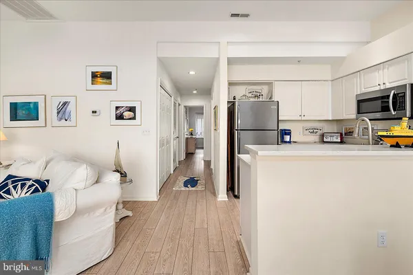 a kitchen with a refrigerator sink and stove