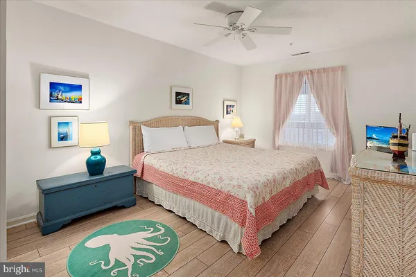 a bedroom with two beds and a window