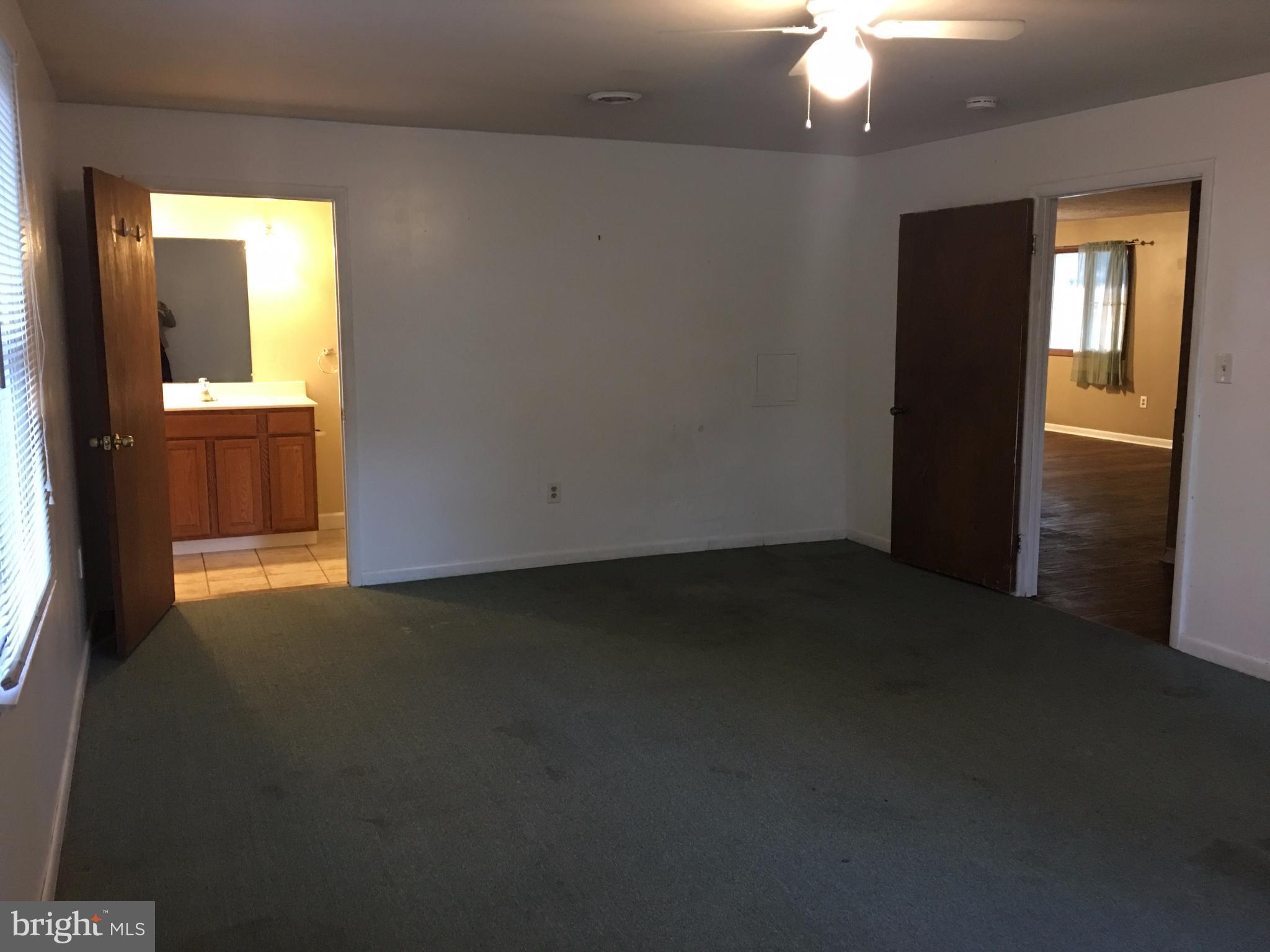 8429 Garland Road Pasadena, MD 21122 - Photo 23 of 32 Master Bedroom w/Full Bath