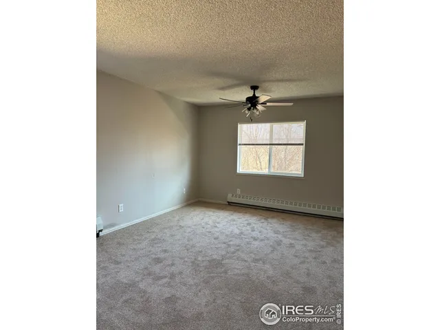 a view of empty room with windows