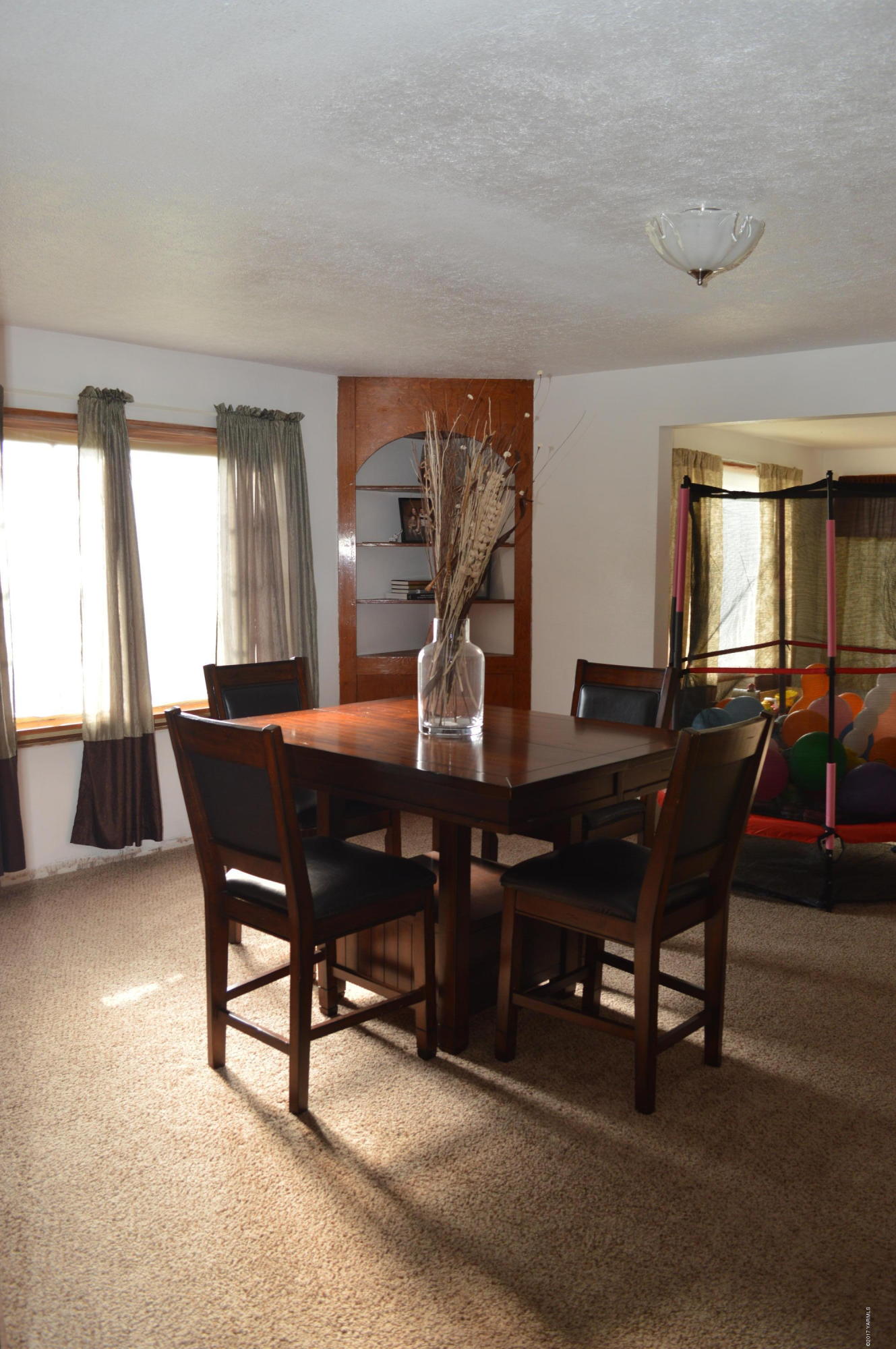 6941 McDonald Road Wapato, WA 98951 - Photo 5 of 24 a view of a dining room with furniture and window