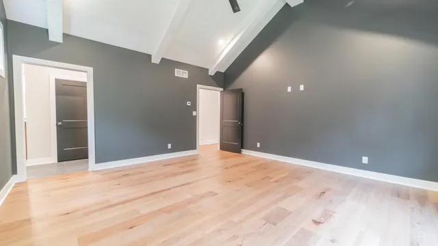 a view of a big room with wooden floor and closet