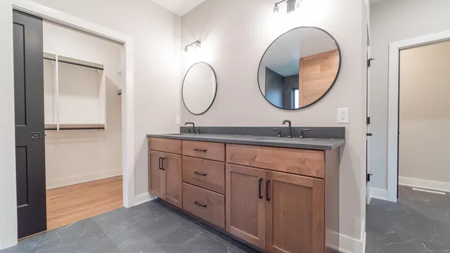 a view of kitchen with stainless steel appliances refrigerator stove microwave and cabinets