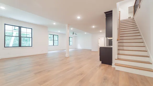 an aerial view of a house with garden space and street view