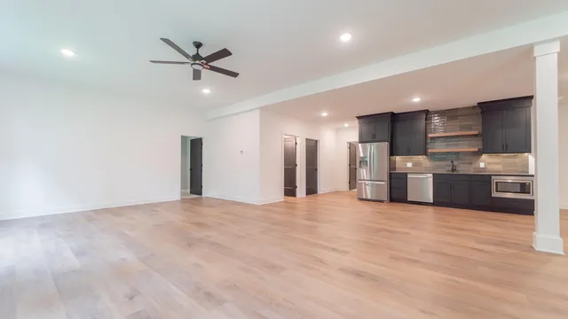 an aerial view of residential houses with outdoor space and street view