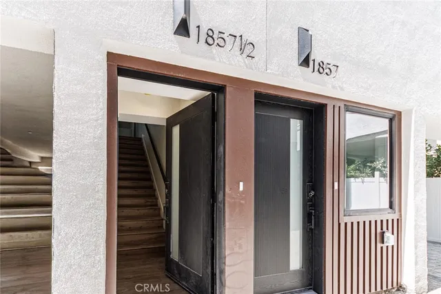 a view of a hallway with entryway front of a house