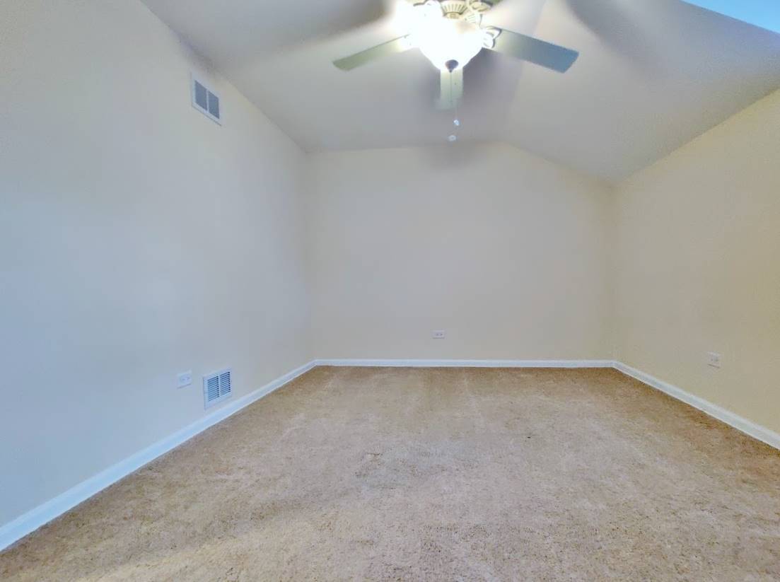 1520 Chippewa Drive Naperville, IL 60563 - Photo 16 of 18 a view of an empty room with a chandelier fan