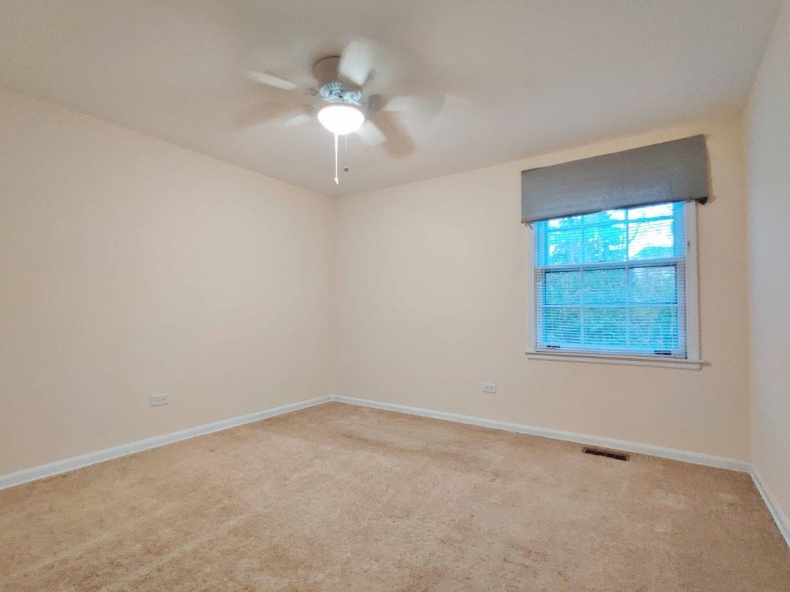 1520 Chippewa Drive Naperville, IL 60563 - Photo 17 of 18 an empty room with a window