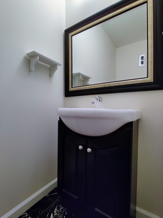 1520 Chippewa Drive Naperville, IL 60563 - Photo 9 of 18 a bathroom with a sink and a mirror