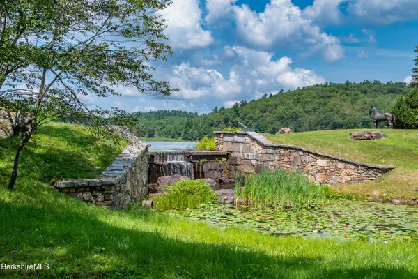 a view of a lake with a yard