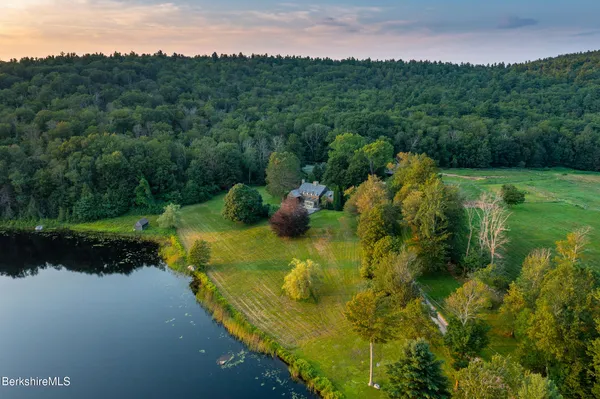 a view of house with yard and entertaining space