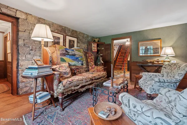 a bedroom with a bed and with furniture