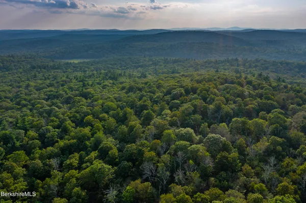 a view of a house with a yard porch and sitting area