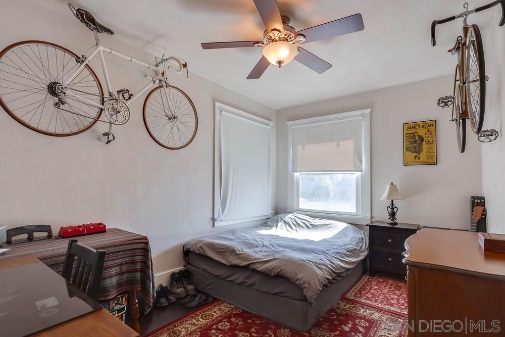 2525 E Street San Diego, CA 92102 - Photo 17 of 46 a bedroom with a bed dresser and a chandelier