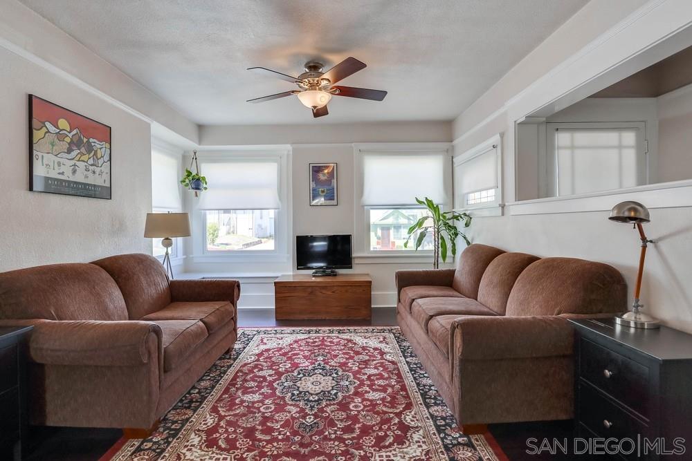 2525 E Street San Diego, CA 92102 - Photo 6 of 46 a living room with furniture ceiling fan and a rug
