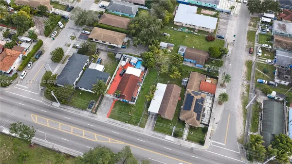 an aerial view of houses with an outdoor space